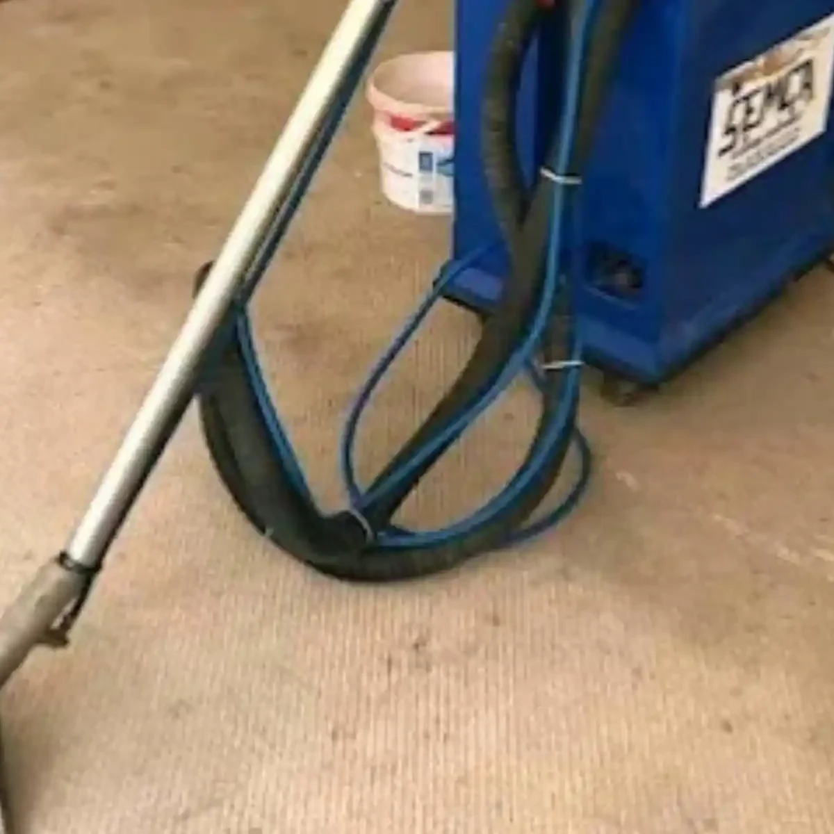 Carpet cleaning machine in use on a household carpet