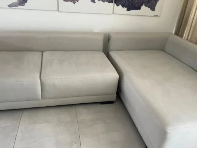 Fabric chair being cleaned as part of an upholstery service